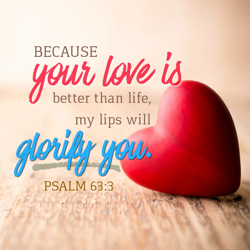 Red heart-shaped candy on a wooden background.